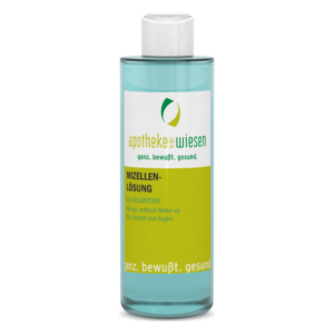 Flasche mit Mizellenlösung in Türkis. Label beschreibt die Anwendung zum Entfernen von Make-up für Gesicht und Augen.