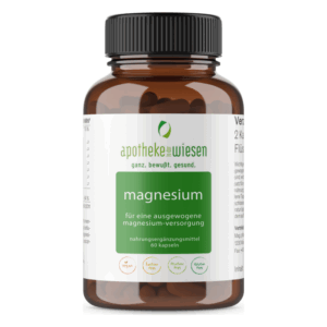 Ein brauner Glasbehälter mit Schraubverschluss, gefüllt mit Magnesiumkapseln, beschriftet mit Inhaltsangaben und veganem Label.