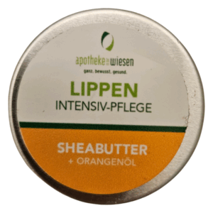 Runde Dose mit Lippenbalsam, beschriftet mit "LIPPEN INTENSIV-PFLEGE SHEABUTTER + ORANGENÖL".